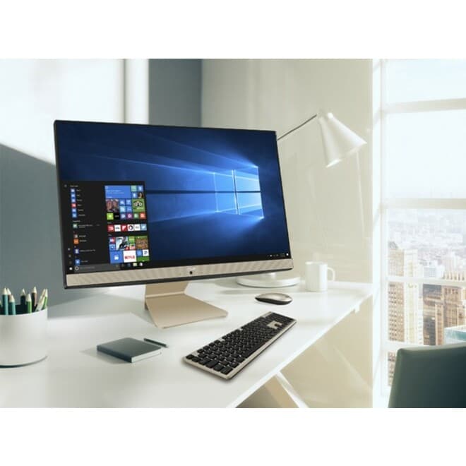 ASUS all-in-one desktop with 23.8-inch display, slim stand, and compact white chassis