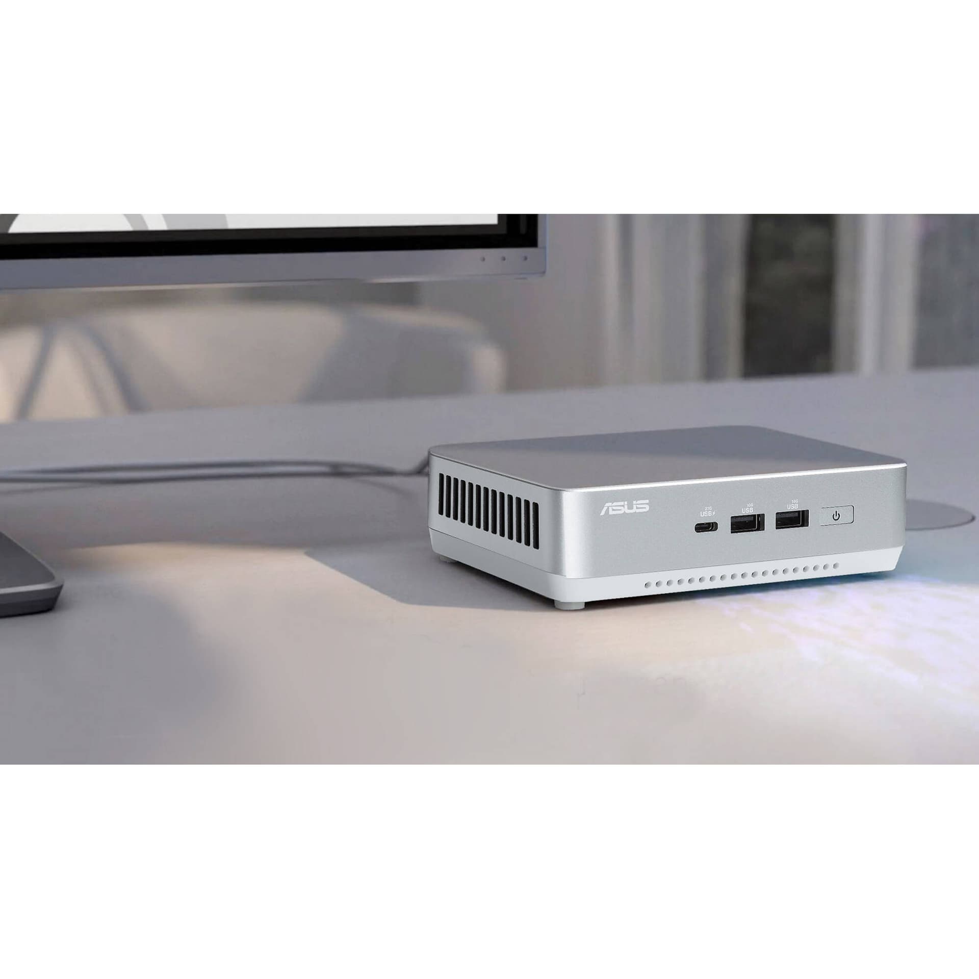 ASUS NUC 14 Pro+ mini PC in silver aluminum chassis with Thunderbolt 4 and VESA mount support